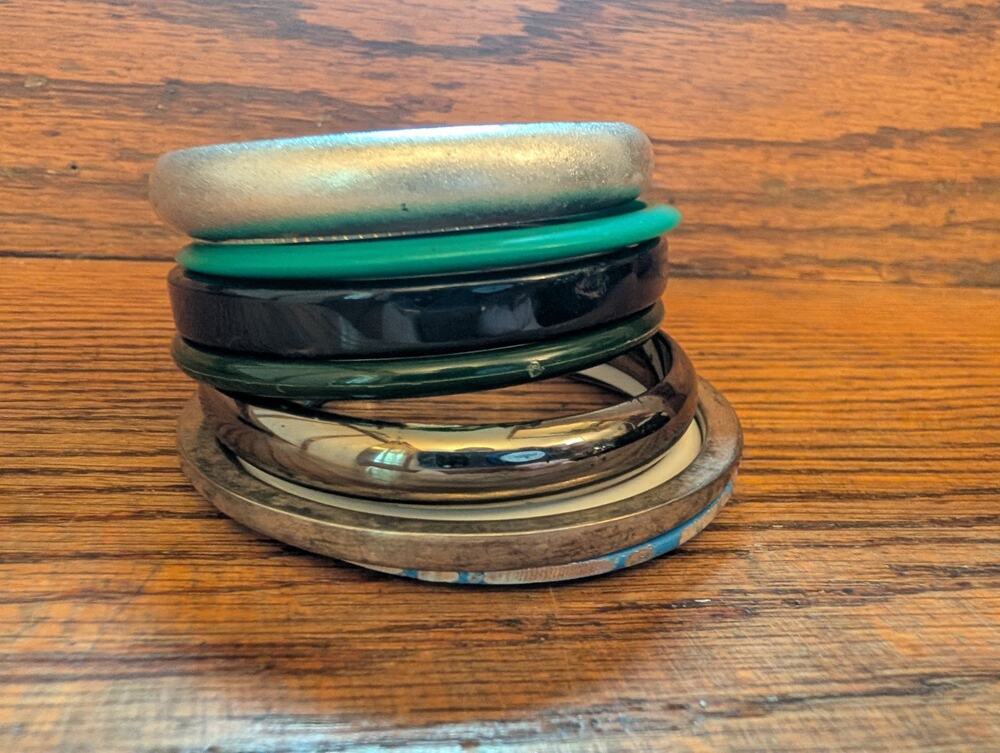 Vintage Stack Of Plastic And Silver Bangels Bracelets